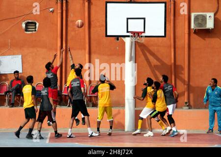 Hyderabad, Pakistan, November 30, 2021. Players are in action during the basket ball match during the Under-21 Games held at Qayyum Sports Complex in Peshawar on Tuesday, November 30, 2021. Stock Photo