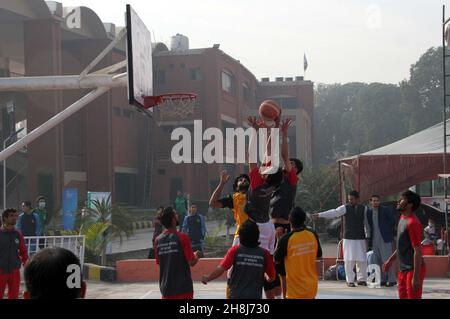 Hyderabad, Pakistan, November 30, 2021. Players are in action during the basket ball match during the Under-21 Games held at Qayyum Sports Complex in Peshawar on Tuesday, November 30, 2021. Stock Photo