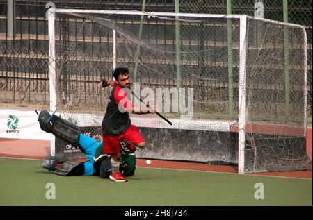 Hyderabad, Pakistan, November 30, 2021. Players are in action during the Hockey match during the Under-21 Games held at Qayyum Sports Complex in Peshawar on Tuesday, November 30, 2021. Stock Photo