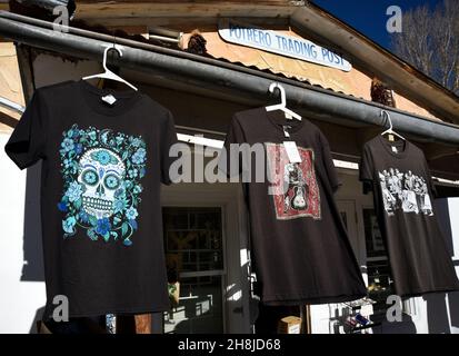 T-shirts designed by British rock musician Jon Langford for sale in a store in Chimayo, New Mexico. Langford is a founding member of the Mekons. Stock Photo