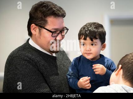 Refugee Hussain Saeedi Samangan and his one year old son Arian who met the Duke of Cambridge during his visit to a hotel in Leeds, which is being used to accommodate refugees evacuated from Afghanistan. Picture date: Tuesday November 30, 2021. Stock Photo
