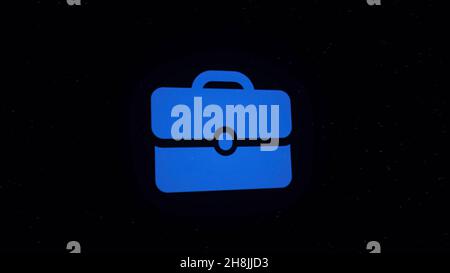 Digital animation of briefcase icon decaying into multicolored moving plexus networks on black background. animation. Technology, business and interne Stock Photo