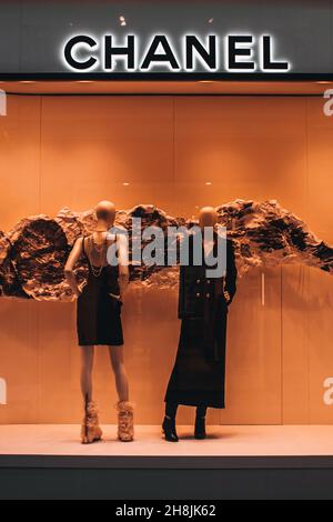 Chanel luxury shop in Moscow. Two mannequins dressed in elegant black dresses. Chanel is a fashion house founded in 1909 specialized in haute couture Stock Photo