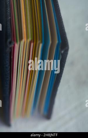 Closeup shot recycled color sheets inside a folder. Handmade book Stock Photo