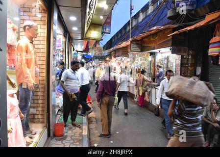 Streets at night in Kolkata. Kolkata (formerly Calcutta) is the capital of India's West Bengal state. Founded as an East India Company trading post, it was India's capital under the British Raj from 1773–1911. Today it’s known for its grand colonial architecture, art galleries and cultural festivals. It’s also home to Mother House, headquarters of the Missionaries of Charity, founded by Mother Teresa, whose tomb is on site. Stock Photo