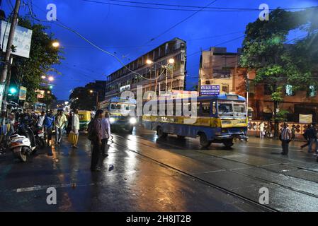 Streets at night in Kolkata. Kolkata (formerly Calcutta) is the capital of India's West Bengal state. Founded as an East India Company trading post, it was India's capital under the British Raj from 1773–1911. Today it’s known for its grand colonial architecture, art galleries and cultural festivals. It’s also home to Mother House, headquarters of the Missionaries of Charity, founded by Mother Teresa, whose tomb is on site. Stock Photo