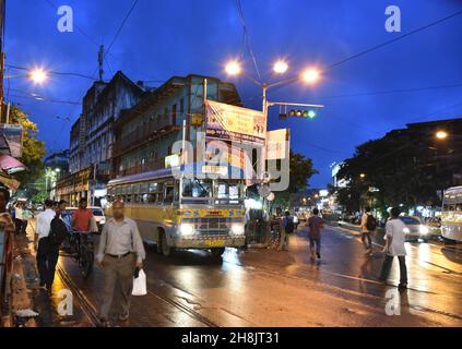 Streets at night in Kolkata. Kolkata (formerly Calcutta) is the capital of India's West Bengal state. Founded as an East India Company trading post, it was India's capital under the British Raj from 1773–1911. Today it’s known for its grand colonial architecture, art galleries and cultural festivals. It’s also home to Mother House, headquarters of the Missionaries of Charity, founded by Mother Teresa, whose tomb is on site. Stock Photo