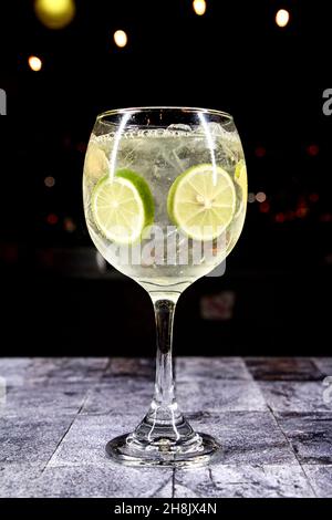 cocktail in a transparent glass with a starry black background, various Stock Photo