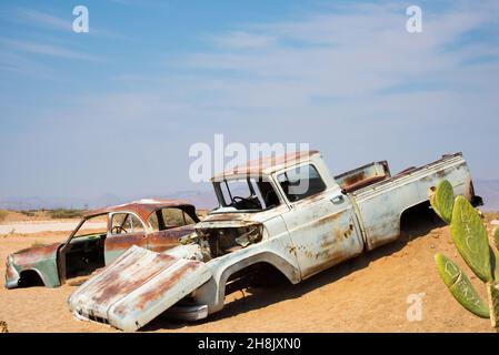 Sossusvlei, Namibia; 08182016: Beautiful old cars with no wheels abandoned in the desert. Africa Stock Photo