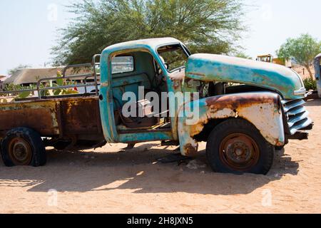 Sossusvlei, Namibia; 08182016: Old green truck with no door abandoned in the desert. Africa Stock Photo