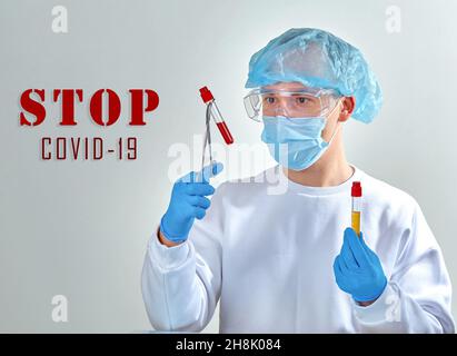 Stop coronavirus COVID19. Medical background, template, wallpaper. Coronavirus disease concept. Doctor in mask with blood tests Stock Photo