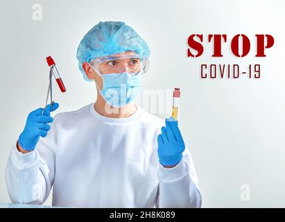 Stop coronavirus COVID19. Medical background, template, wallpaper. Coronavirus disease concept. Doctor in mask with blood tests Stock Photo