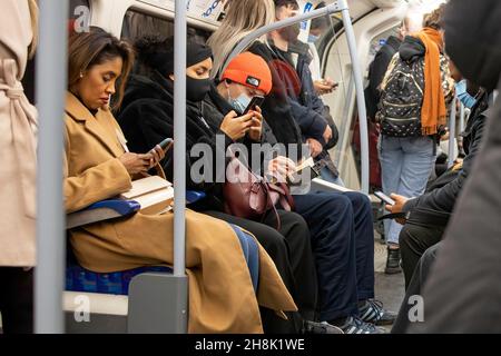 London, UK. 30th Nov, 2021. A passenger is seen without a facemask in the London underground. Wearing of face coverings for all passengers on public transport was made mandatory starting 30th November 2021 as part of the government measures to tackle the spread of the Omicron COVID-19 variant. Credit: SOPA Images Limited/Alamy Live News Stock Photo