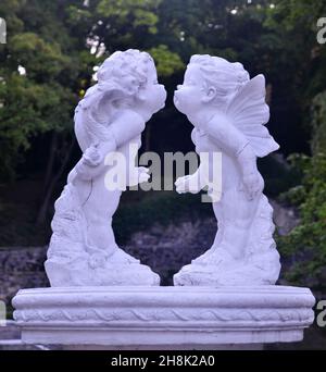 Sculpture of two little angels kissing. Urban arts and architecture examples of Ukraine Stock Photo