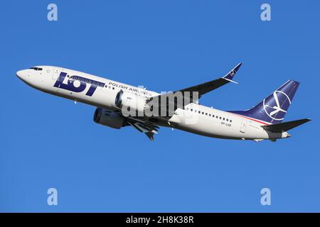 A Boeing 737 MAX 8 operated by LOT departs from London Heathrow Airport Stock Photo