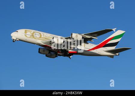 An Airbus A380 operated by Emirates departs from London Heathrow Airport Stock Photo