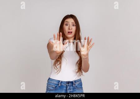 Scared Shocked Woman Isolated On Gray Background Stock Photo