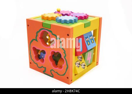 motor skills for children. wooden sensory cube for toddlers. Stock Photo