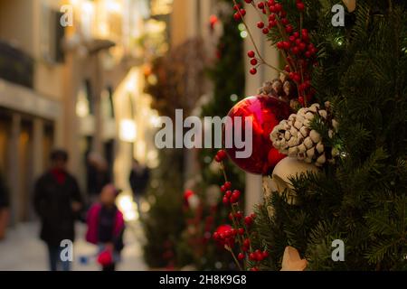 Detail of a Christmas tree on a sunny street with copy space Stock Photo