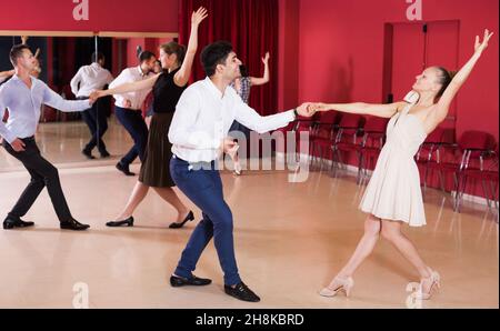 People practicing vigorous lindy hop movements Stock Photo
