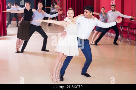 Smiling people practicing passionate samba Stock Photo