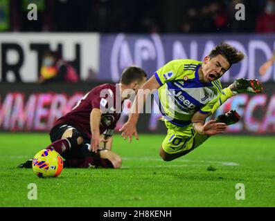 Salerno, Italy. 30th Nov, 2021. Juventus' Paulo Dybala (R) falls during a Serie A football match between FC Juventus and Salernitana in Salerno, Italy, on Nov. 30, 2021. Credit: Alberto Lingria/Xinhua/Alamy Live News Stock Photo