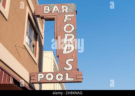 Idaho Falls, Idaho - August 22, 2021: Retro neon sign for Fords Bar and Pool tables in the downtown area Stock Photo