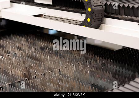 Laser cutting machine. Working table with laser cutting slats. Selective focus. Stock Photo