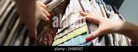 Multi-colored fabrics on exhibition stand in store Stock Photo