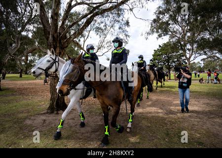 Mounted Police walk through the Elsternwick park as they push protesters back during the Freedom protest. Freedom protests are being held in Melbourne every Saturday and Sunday in response to the governments COVID-19 restrictions and continuing removal of liberties despite new cases being on the decline. Victoria recorded a further 21 new cases overnight along with 7 deaths.