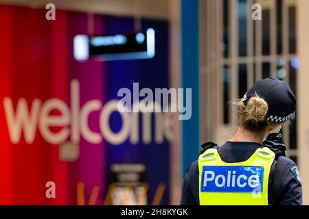 A police officer stands guard near a welcome sign in the Chadstone Shopping Centre after a small protest was held during a series of pop up Freedom protests. Freedom protests are being held in Melbourne every Saturday and Sunday in response to the governments COVID-19 restrictions and continuing removal of liberties despite new cases being on the decline. Victoria recorded a further 14 new cases overnight along with 7 deaths. Stock Photo