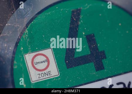 Berlin, Germany. 10th Oct, 2021. A Euro 4 sticker can be seen on the windscreen of a car. A green fine dust sticker is given to vehicles in emission class 4. With this environmental sticker, all environmental zones may be entered without restriction. Credit: Fernando Gutierrez-Juarez/dpa-Zentralbild/dpa/Alamy Live News Stock Photo