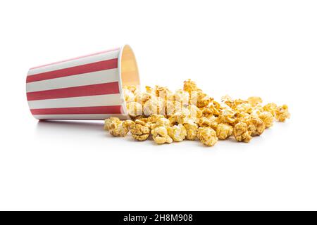Sweet caramel popcorn in paper cup isolated on white background. Stock Photo