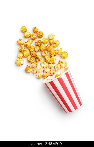Sweet caramel popcorn in paper cup isolated on white background. Stock Photo