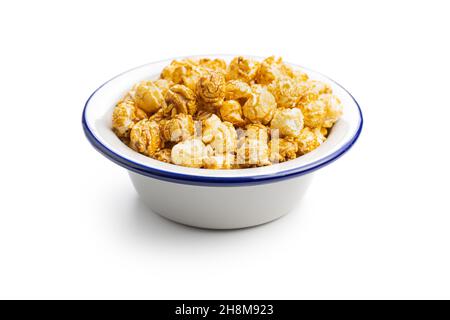 Sweet caramel popcorn in bowl isolated on white background. Stock Photo