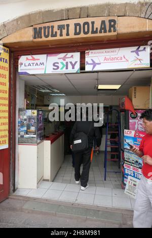 shop with Avianca sign in Cusco Peru travel agents agent bus tours artwork poster people visit outside steps ladder cash money exchange Multi dolar Stock Photo