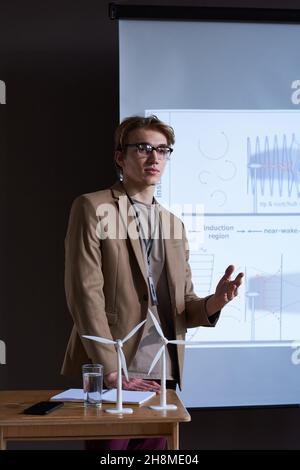 Young architect in eyeglasses presenting his project at business conference Stock Photo