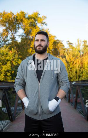 portrait of a bearded Caucasian man in sportswear outdoors Stock Photo