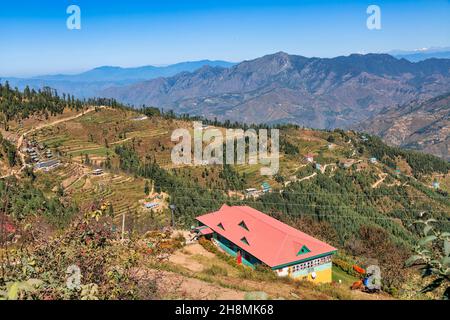Scenic hill station at Himachal Pradesh, India with aerial view wof village houses on the mountain slopes with scenic Himalaya landscape at Sarahan Stock Photo
