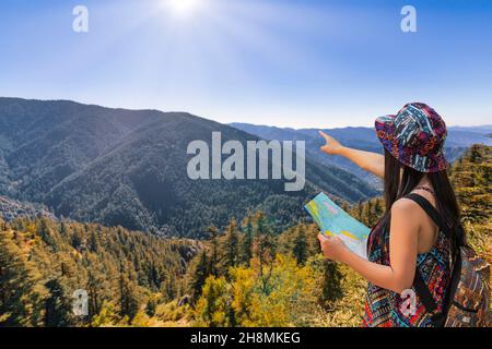 Female tourist hiker get an aerial view of scenic mountain landscape at Sarahan Himachal Pradesh, India Stock Photo