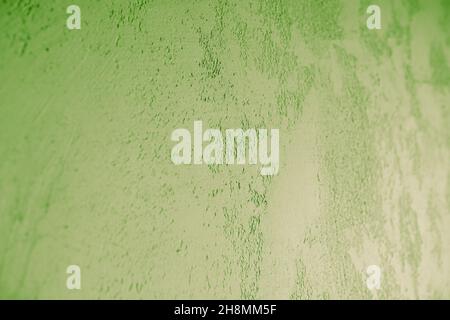 Green wall plaster close-up. Decorative Venetian plaster. Stock Photo