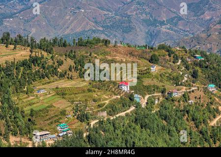 Scenic hill station at Himachal Pradesh, India with aerial view wof village houses on the mountain slopes with scenic Himalaya landscape at Sarahan Stock Photo