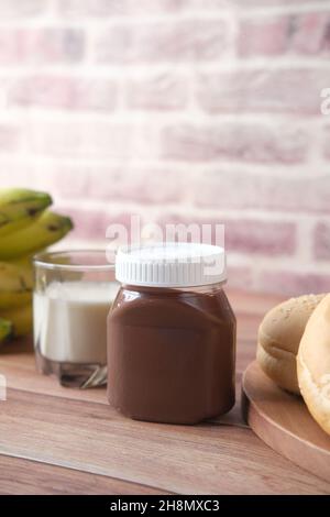 Chocolate Hazelnut cream in a container on table  Stock Photo