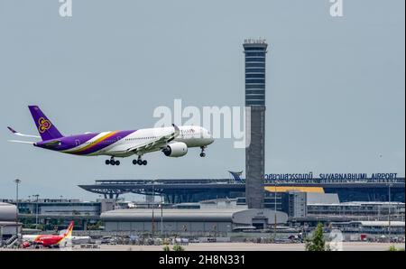 Air traffic control tower Suvarnabhumi Airport and Thai Airways Airbus A300-600 aircraft, Bangkok, Thailand Stock Photo