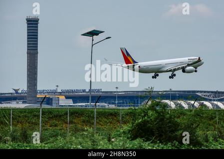 Air traffic control tower Suvarnabhumi Airport and aircraft Philippine Airlines Airbus A330-300 Bangkok, Thailand Stock Photo