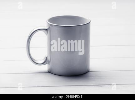 White coffee cup on the dinner table, mock-up Stock Photo