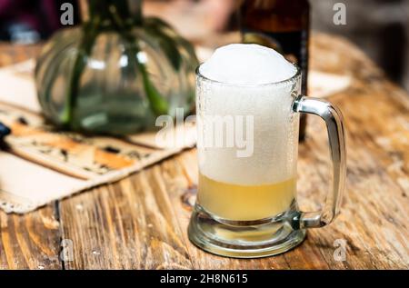 Glass cup of beer with foam Stock Photo
