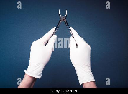 Hand in glove holding medical flatterns Stock Photo