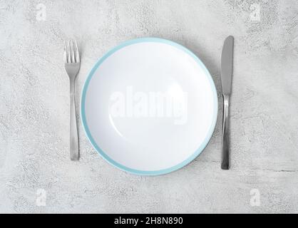 Fork,knife and white plate Stock Photo
