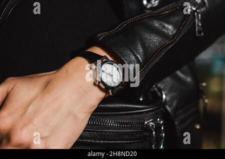 Fashionable watch on a woman's hand. Classic stylish wrist watch Stock Photo